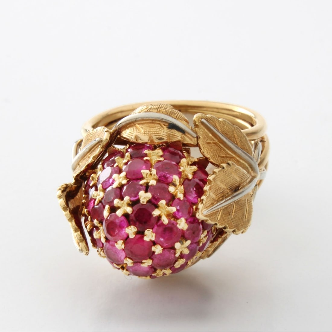 Ruby and 18K Ring: Vintage Round Cut Ruby and 18 Karat Yellow Gold Dome Cluster Ring. Rubies with vivid color. Stamped 18K 750. Ring size 6-1/2. Approx. weight: 14.10 grams. Kodner Galleries offers phone and absentee