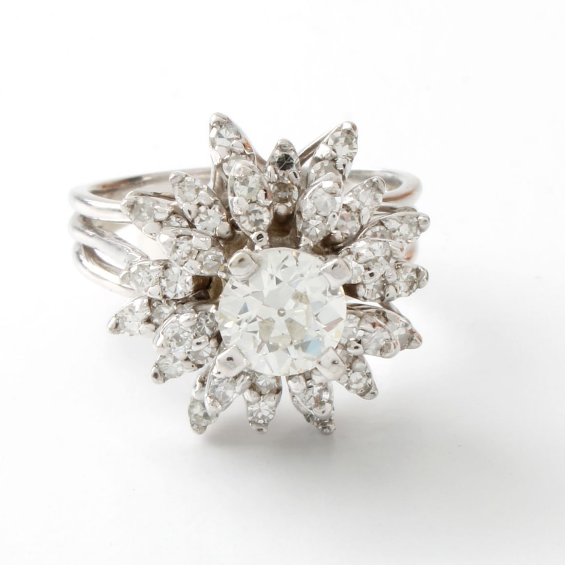 Diamond and 14K Starburst Ring: Vintage Diamond and 14 Karat White Gold Starburst Cluster Ring. Set in the center with an approx. 1.0 carat old European cut diamond, J color, SI1 clarity and accented with approx. 1.50 carat TW