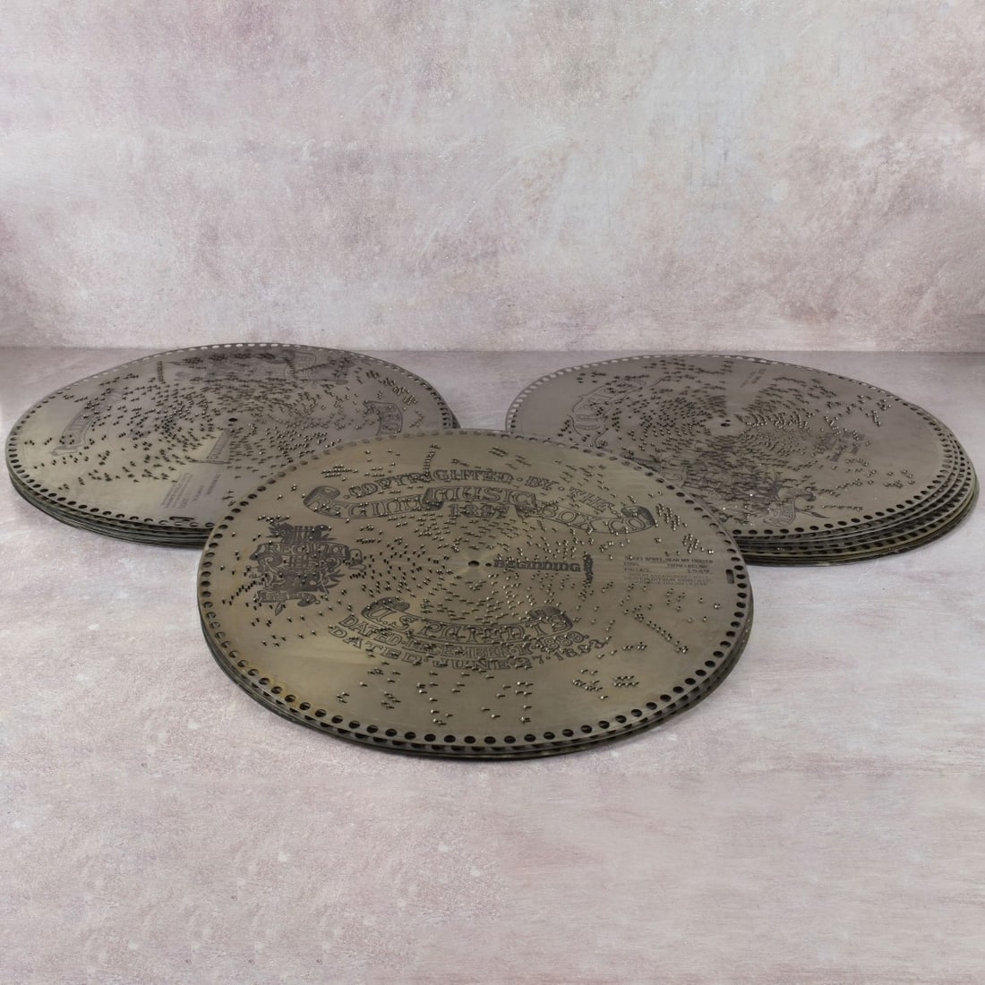 Regina 15-1/2" Metal Disks: Thirty (30) Regina 15-1/2" Metal Disks of Assorted Songs. Kodner Galleries offers phone and absentee bidding at a low, flat 21% buyer’s premium without surcharge or hidden fees. For information,