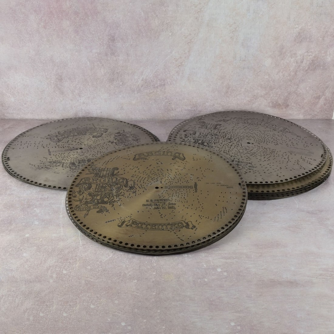 Regina 15-1/2" Metal Disks: Thirty (30) Regina 15-1/2" Metal Disks of Assorted Songs. Kodner Galleries offers phone and absentee bidding at a low, flat 21% buyer’s premium without surcharge or hidden fees. For information,