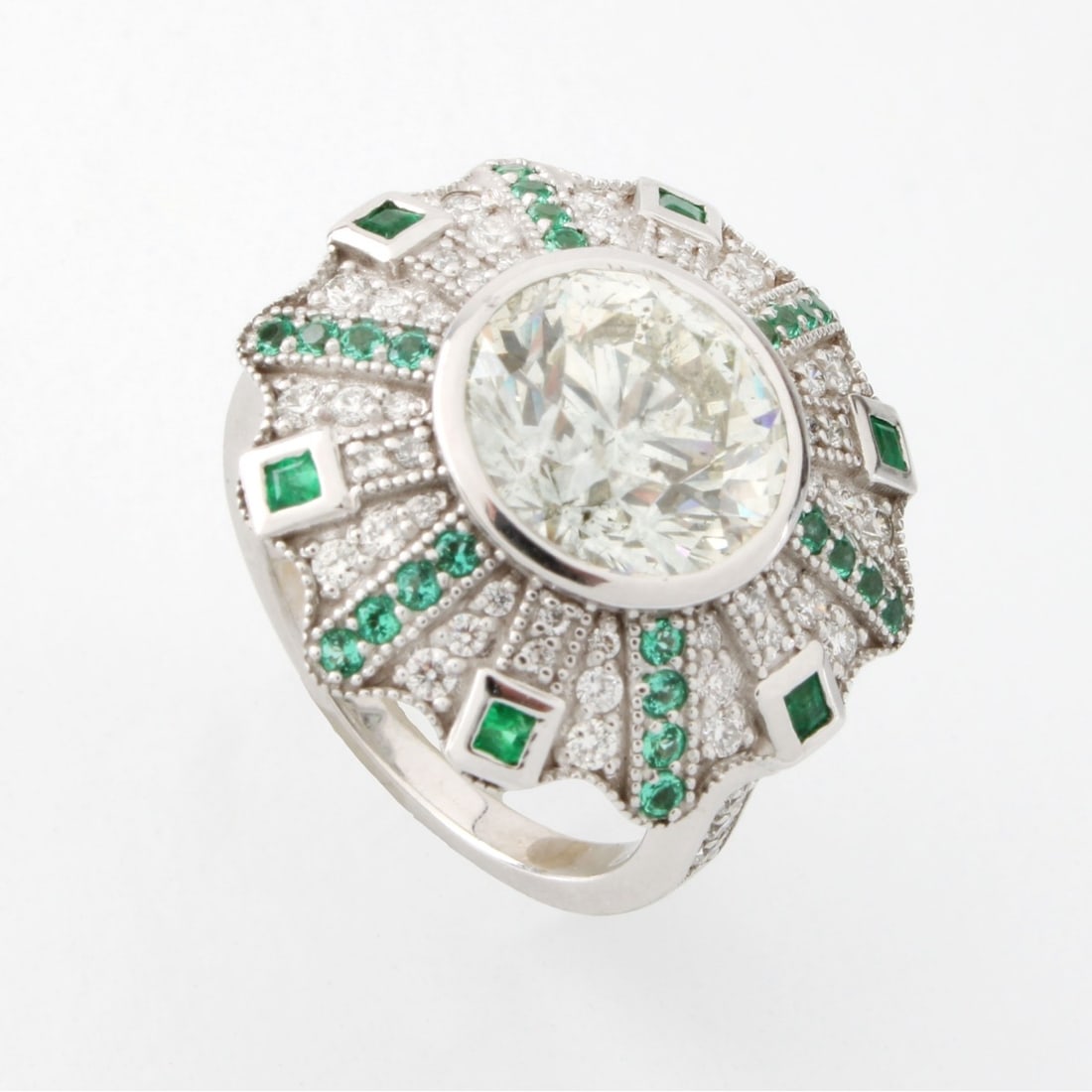 GIA Diamond, Emerald and 18K Ring: GIA Certified Diamond, Emerald and 18 Karat White Gold Ring. Set in the center with a 4.0 carat round brilliant cut diamond, L color, I1 clarity and accented with 1.75 carat TW round and baguette cut