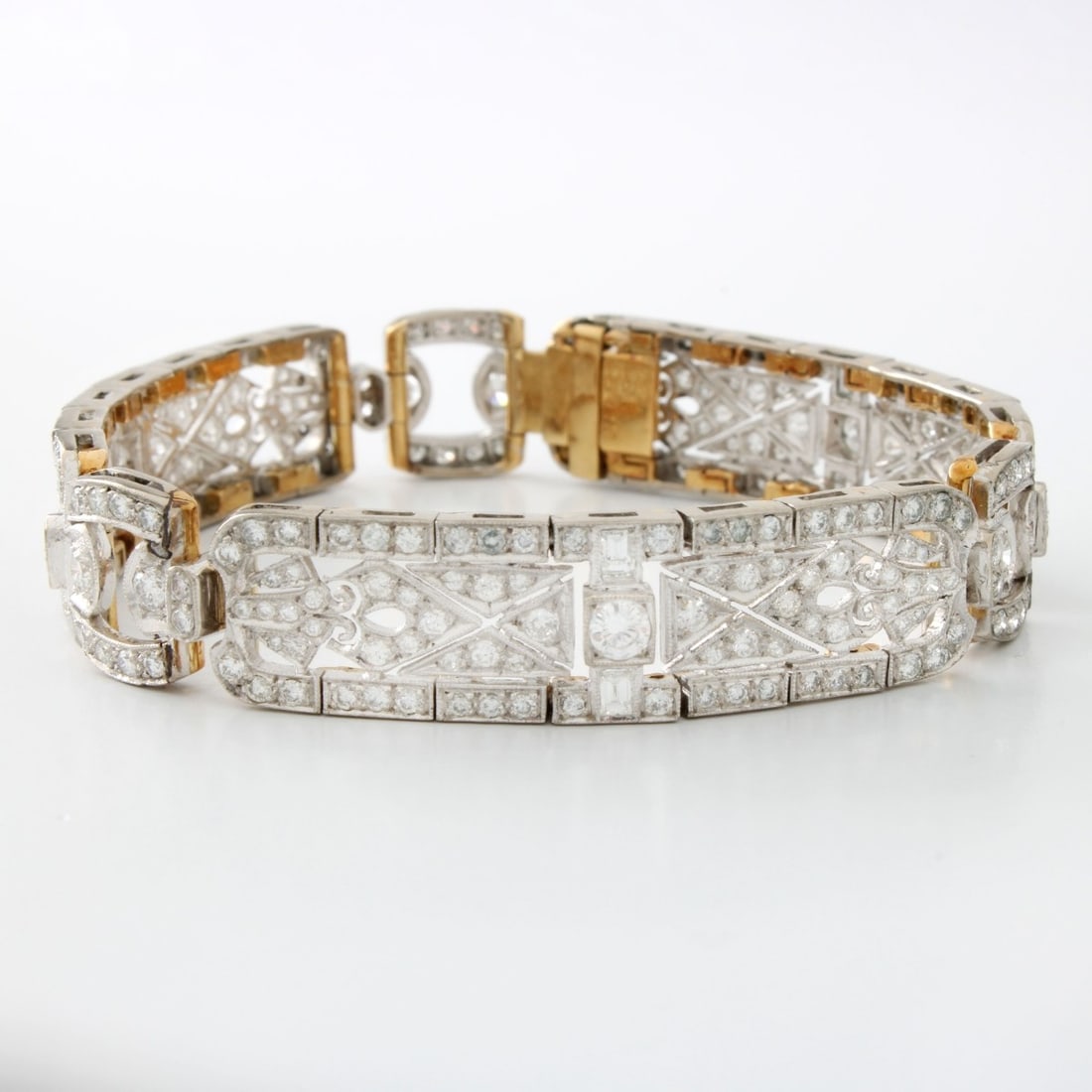 Diamond, Platinum and 18K Bracelet: Art Deco Approx. 6.0 Carat TW Round Brilliant Cut Diamond, Platinum and 18 Karat Yellow Gold Link Bracelet. Diamonds G-H color, VS clarity. Measures 6-3/4" L, 7/16" W. Approx. weight: 31.20 grams.