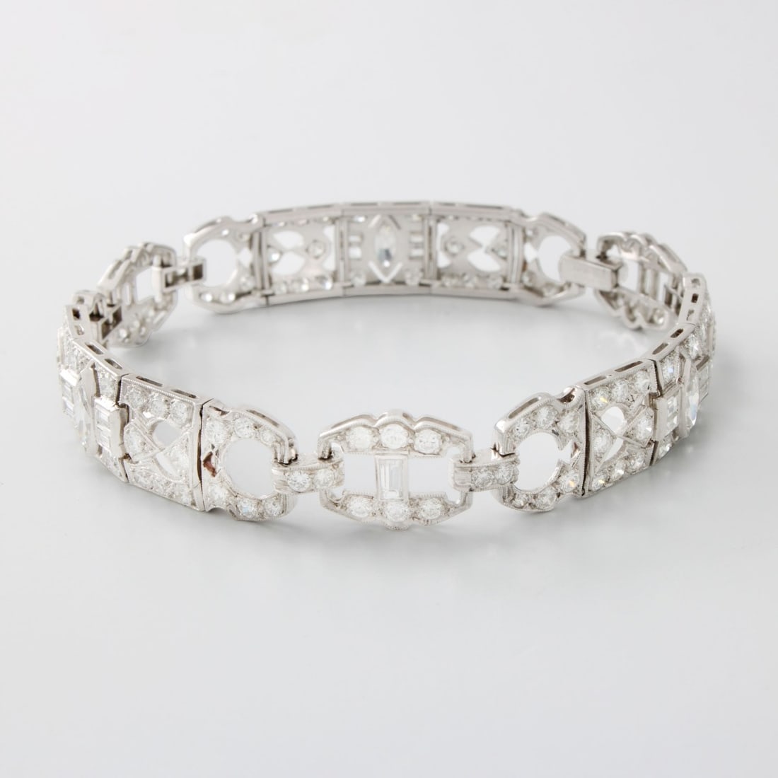 Deco Diamond and Plat. Bracelet: Art Deco Approx. 6.0 Carat TW Round Brilliant, Marquise and Baguette Cut Diamond and Platinum Link Bracelet. Diamonds G-H color, VS clarity. Measures 7-1/4" L 3/8" W. Approx. weight: 23.60 grams.