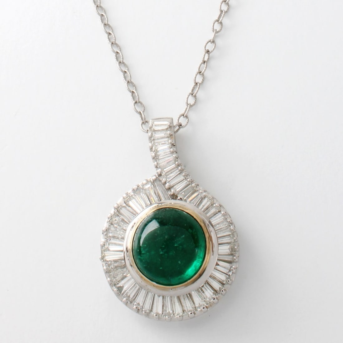 Emerald, Diamond and 18K/14K Necklace: GIA Certified Vintage 13.42 Carat Double Cabochon Colombian Emerald, 5,0 Carat TW Tapered Baguette Cut Diamond and 18 Karat White Gold Pendant with 14 Karat White Gold Chain. Emerald with vivid