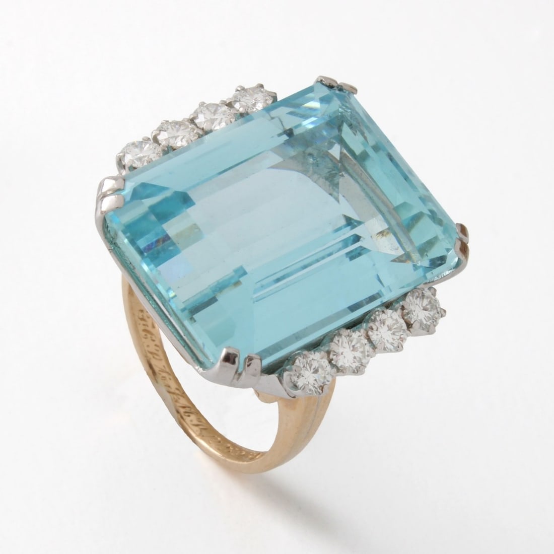 Aquamarine, Diamond, 18K & Plat. Ring: Vintage Approx. 33.45 Carat Gem Quality Octagonal Step Cut Aquamarine, .80 Carat TW Eight Round Brilliant Cut Diamond, 18 Karat Yellow Gold and Platinum Cocktail Ring. Aquamarine with good color and
