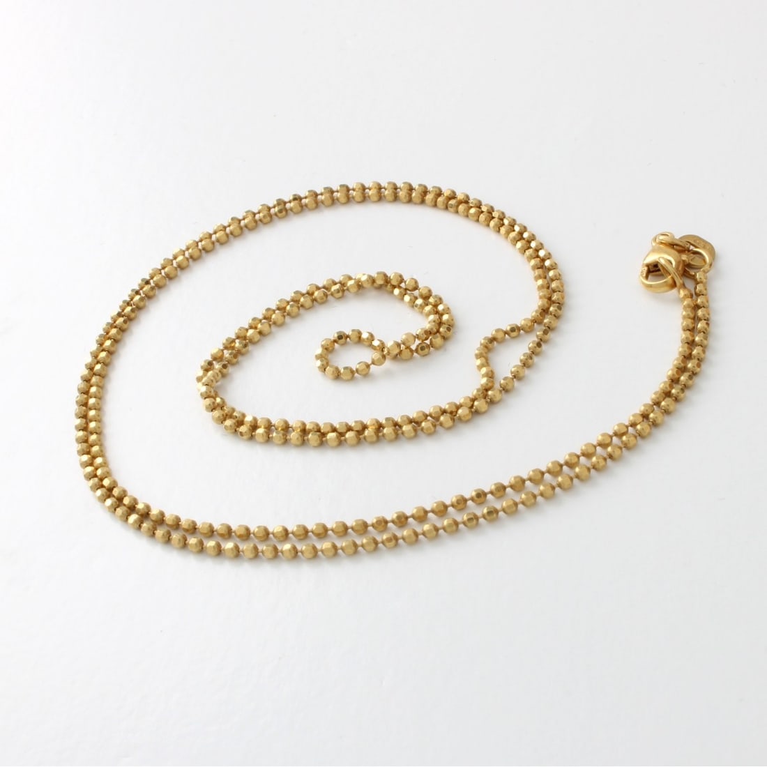 14K Chain: Vintage Delicate 14 Karat Yellow Gold Chain. Clasp stamped 14K. Measures 24" L. Approx. weight: 4.94 grams. Kodner Galleries offers phone and absentee bidding at a low, flat 21% buyer’s premium