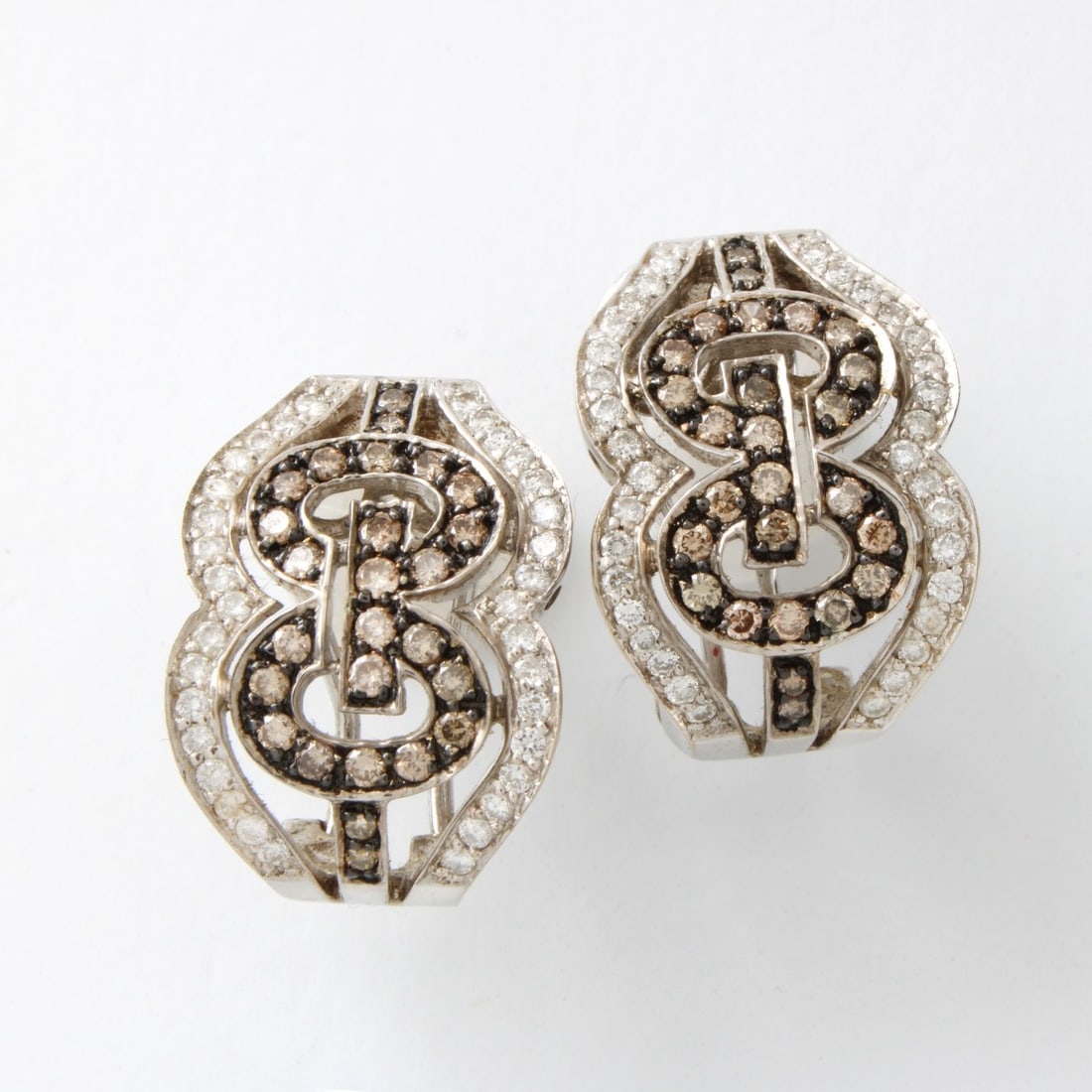 Diamond, Onyx and 18K Earrings: Vintage Small Round Cut White and Champagne Color Diamond, Black Onyx and 18 Karat White Gold "GG" Earrings. Stamped 18K 750. Measure 3/4" x 9/16". Kodner Galleries offers phone and absentee bidding