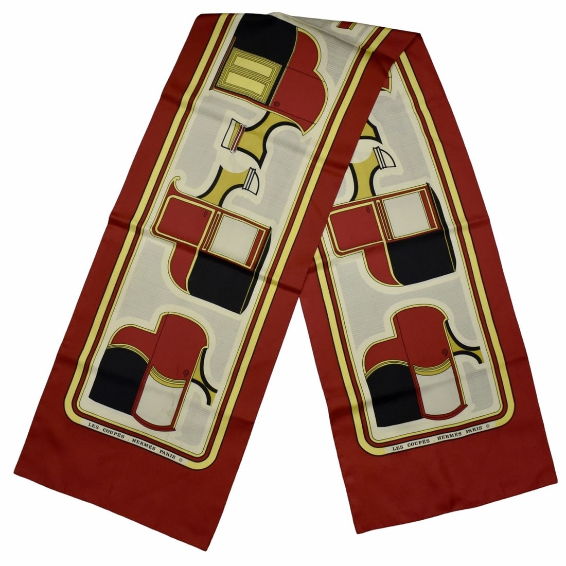 Hermes Silk Scarf: Vintage Hermes Silk Scarf. Signed 'Les Coupes. Hermes Paris". Measures 68" L, 12-1/2" W. Kodner Galleries offers phone and absentee bidding at a low, flat 21% buyer’s premium without surcharge or