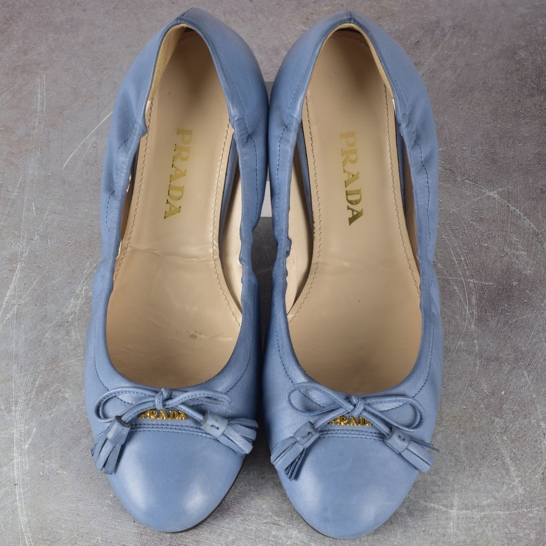 Prada Ballet Slippers: Prada Light Blue Leather Ballet Slippers with Tassels Size 37. Kodner Galleries offers phone and absentee bidding at a low, flat 21% buyer’s premium without surcharge or hidden fees. For