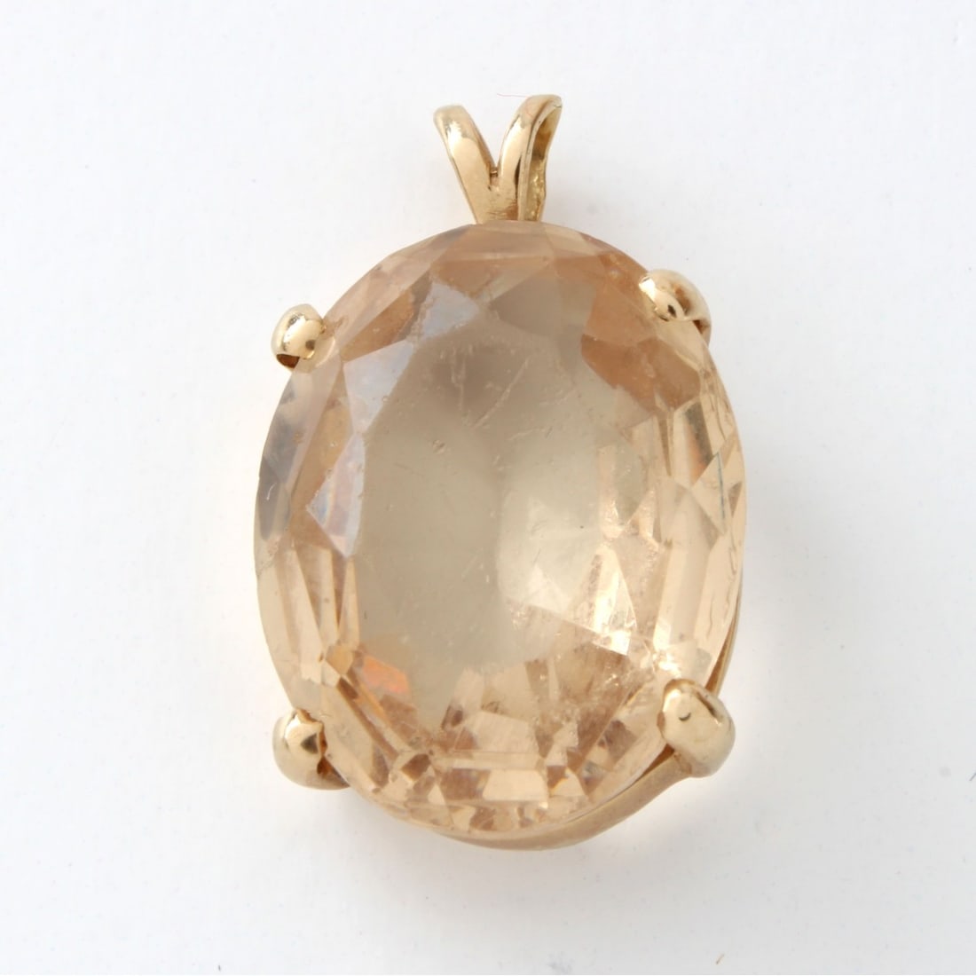 Citrine and 14K Pendant: Vintage Oval Cut Citrine and 14 Karat Yellow Gold Pendant. Citrine measures 20mm x 15.5mm. Approx. weight: 7.67 grams. Kodner Galleries offers phone and absentee bidding at a low, flat 21% buyer’s