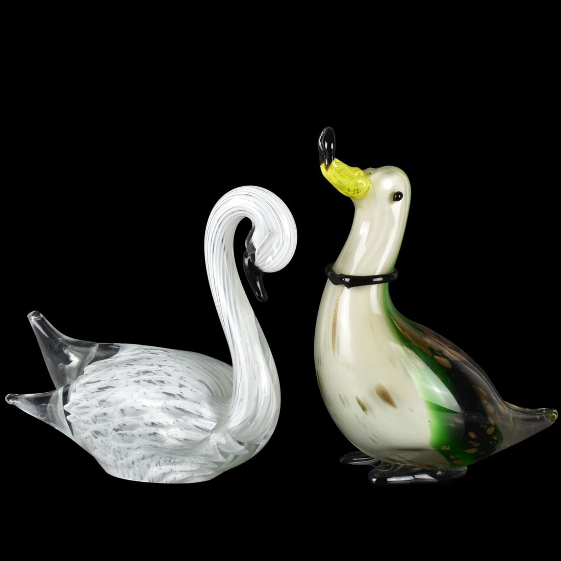 Vintage Murano Glass Sculptures: Two (2) Vintage Murano Glass Sculptures. One (1) swan with their head down, measures: 7-1/4" high, 8-1/4" wide, 3-1/4" deep, one (1) duck with its beak up, measures: 8-1/2" high, 6-1/4" wide, 3-1/2"