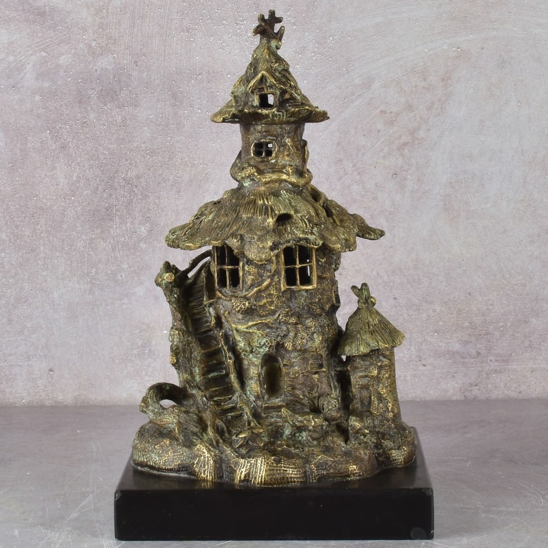 Vintage Gilded Bronze Fairy Tower: Vintage Gilded Bronze Fairy Tower Candle Holder with Two (2) Hinged Thatched Roofs That Open to Reveal Compartments Mounted on a Black Marble Base. Measures: 9" high, 4-3/4" wide, 5-1/2" deep, base
