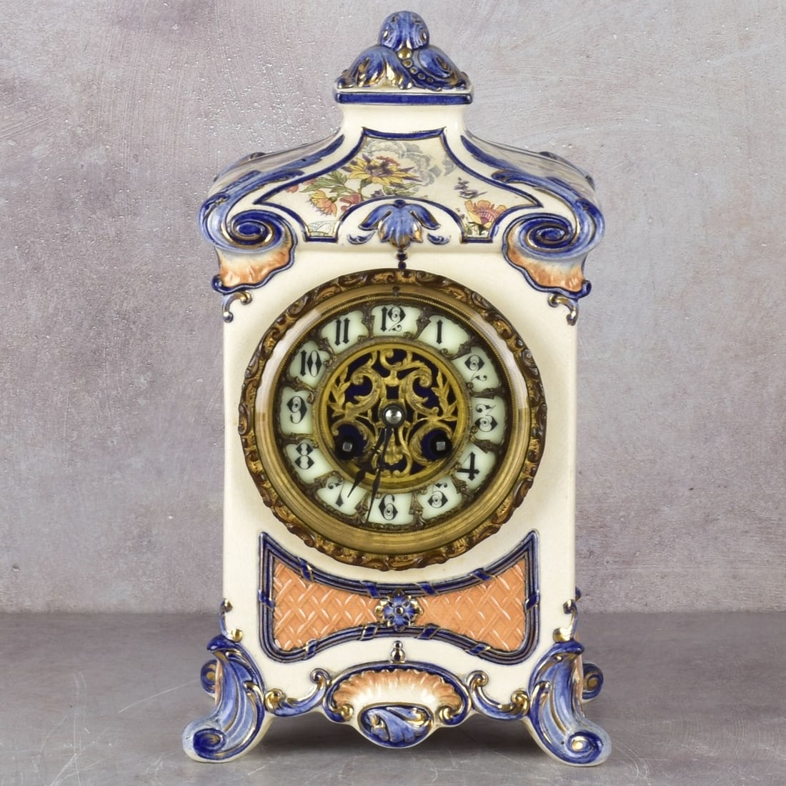 French Sarreguemines F. Marti Clock: Antique French Sarreguemines Pottery F. Marti Clock with Painted Porcelain Dial. Case with painted floral design. Signed F Marti to movement and Serreguemines to base. With pendulum and keys.