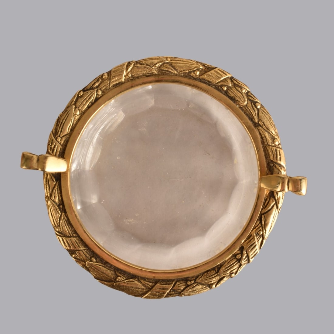 Vintage Assorted Tableware: Vintage Brass and Glass Wine Coaster along with Two Italian Porcelain Ashtrays. Porcelain items are signed. Largest measures 2-7/8" H x 5-1/2" W. Kodner Galleries offers phone and absentee bidding at