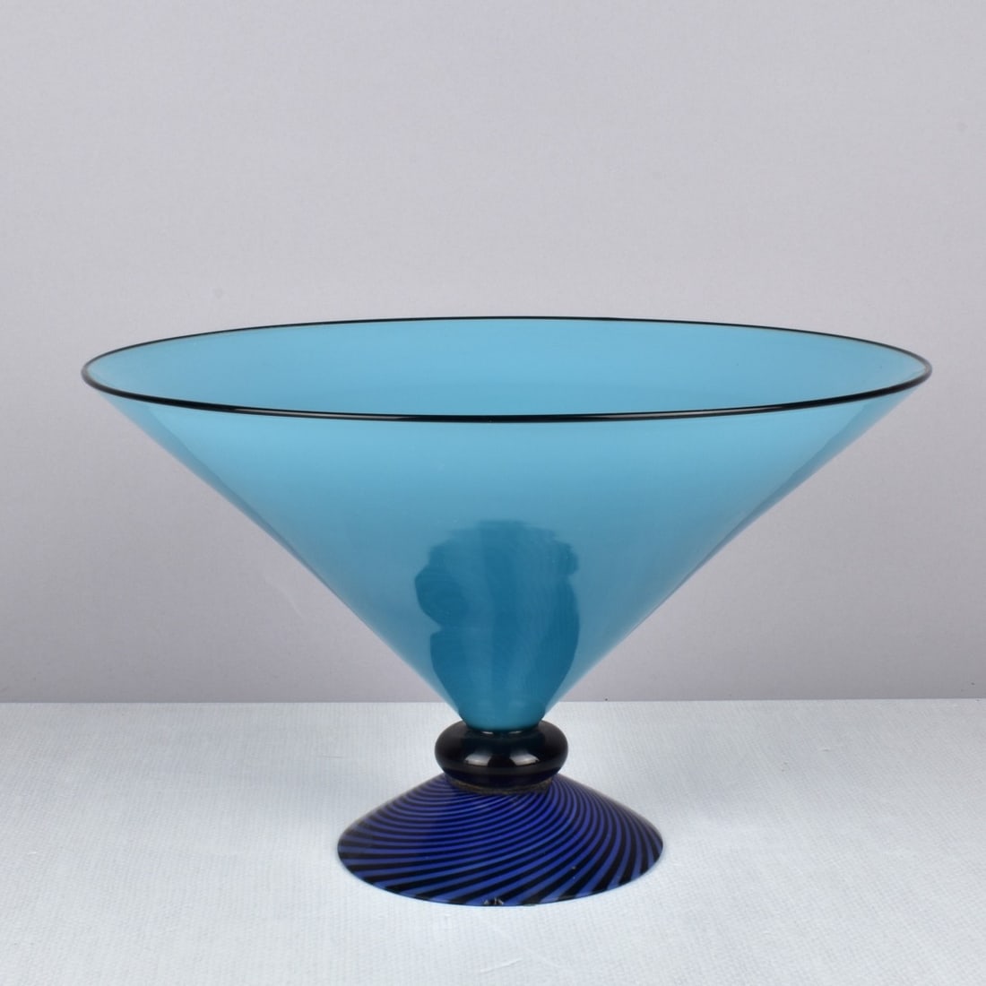 Lino Tagliapietra, Italian (b. 1934): Lino Tagliapietra, Italian (b. 1934) Signed Original Limited Edition for Marina Angelin Effetre Internationale bowl. Crafted of hand blown blue with black V shaped bowl over a black roundelle with