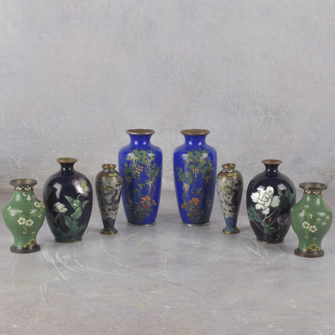 Japanese Cloisonne Vases: Four (4) Pairs of Vintage Japanese Cloisonne Vases on Copper. One pair decorated with hanging wisteria on a royal blue ground, measures: 6" high, 2-1/2" diameter, one pair decorated with large