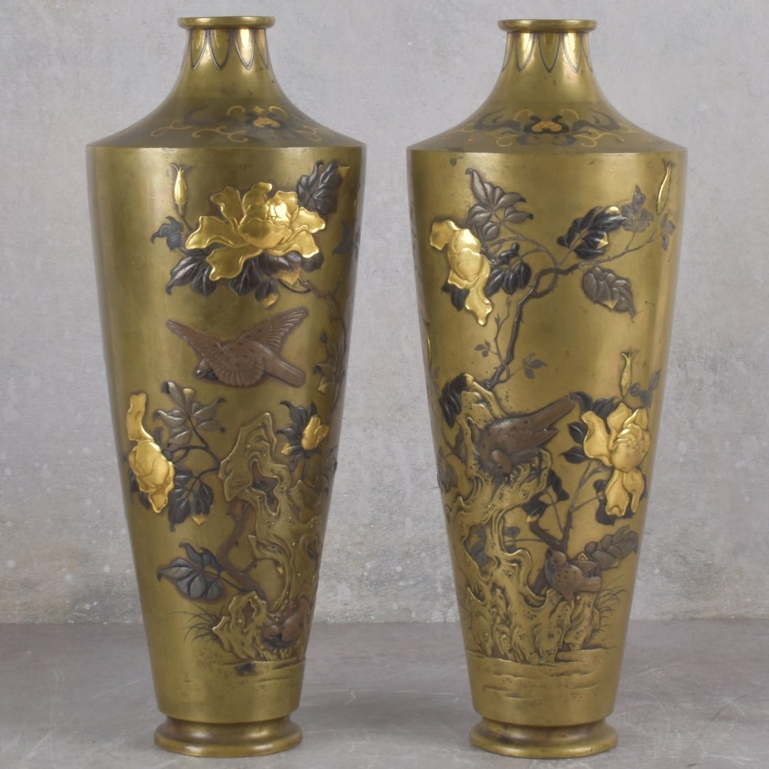 Japanese Mixed Metal Vases: Meiji Period (1868-1912) Japanese Mixed Metal Vases. Decorated with phoenix birds. trees and sparrows with finely inlaid gold, silver and bronze. Both artist signed to the bottoms. Measures: 13-3/4" h
