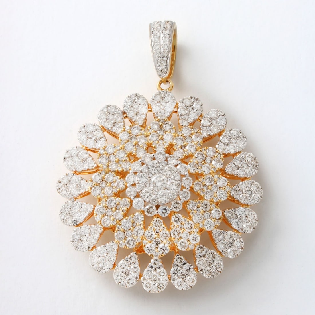 Diamond and 14K Pendant: 5.54 Carat TW Illusion Set Round Brilliant Cut Diamond and 14 Karat White and Yellow Gold Pendant. Diamonds F-H color, VS1-VS2 clarity. Stamped 585. Measures 1-3/4" L, 1-3/8" diameter. Approx.