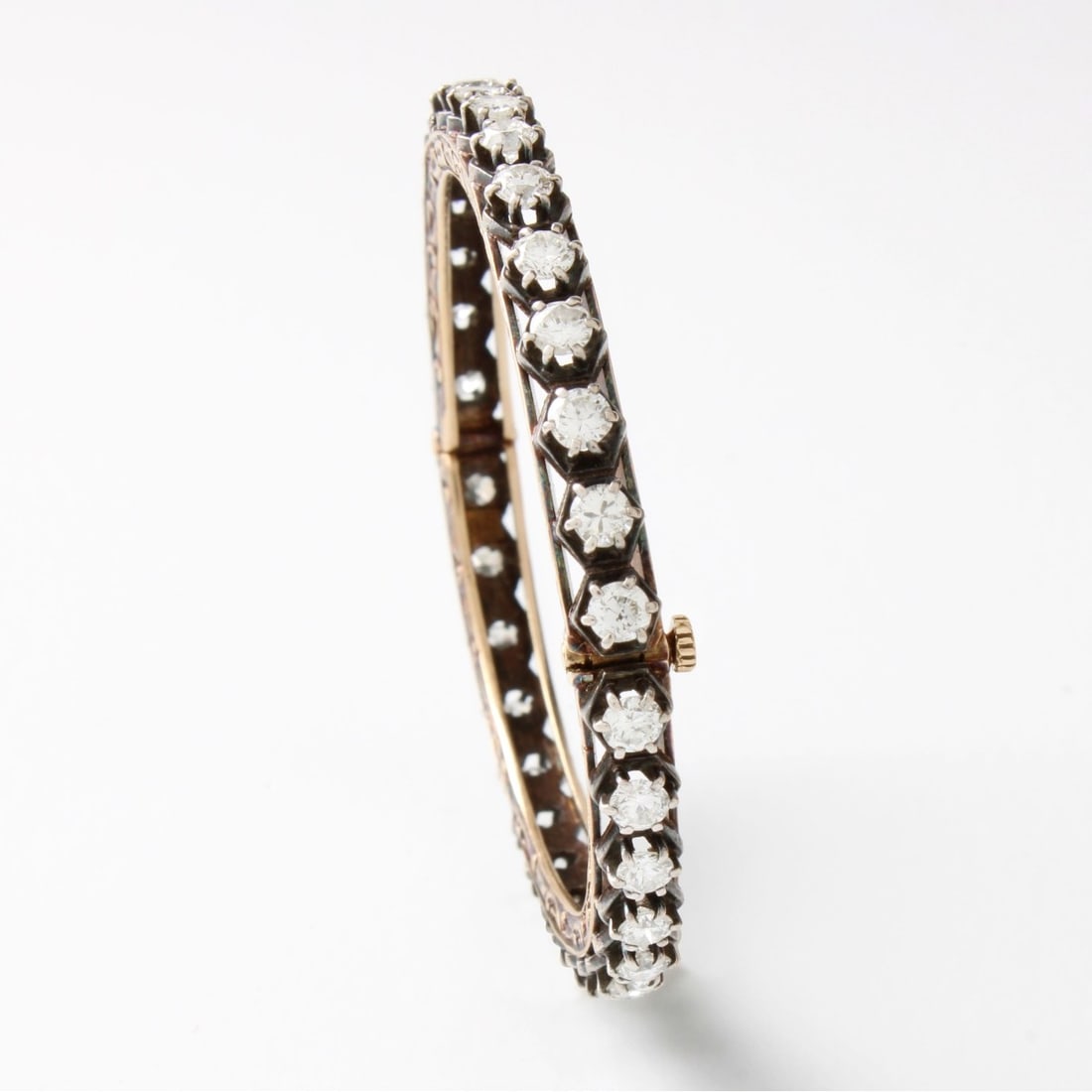 Diamond, Platinum and 18K Bracelet: Antique Approx. 4.25 Carat TW Round Brilliant Cut Diamond, Platinum and 18 Karat Yellow Gold Cuff Bangle Bracelet. Diamonds H-I color, VS-SI clarity. Measures 5-3/4" interior circumference. Approx.