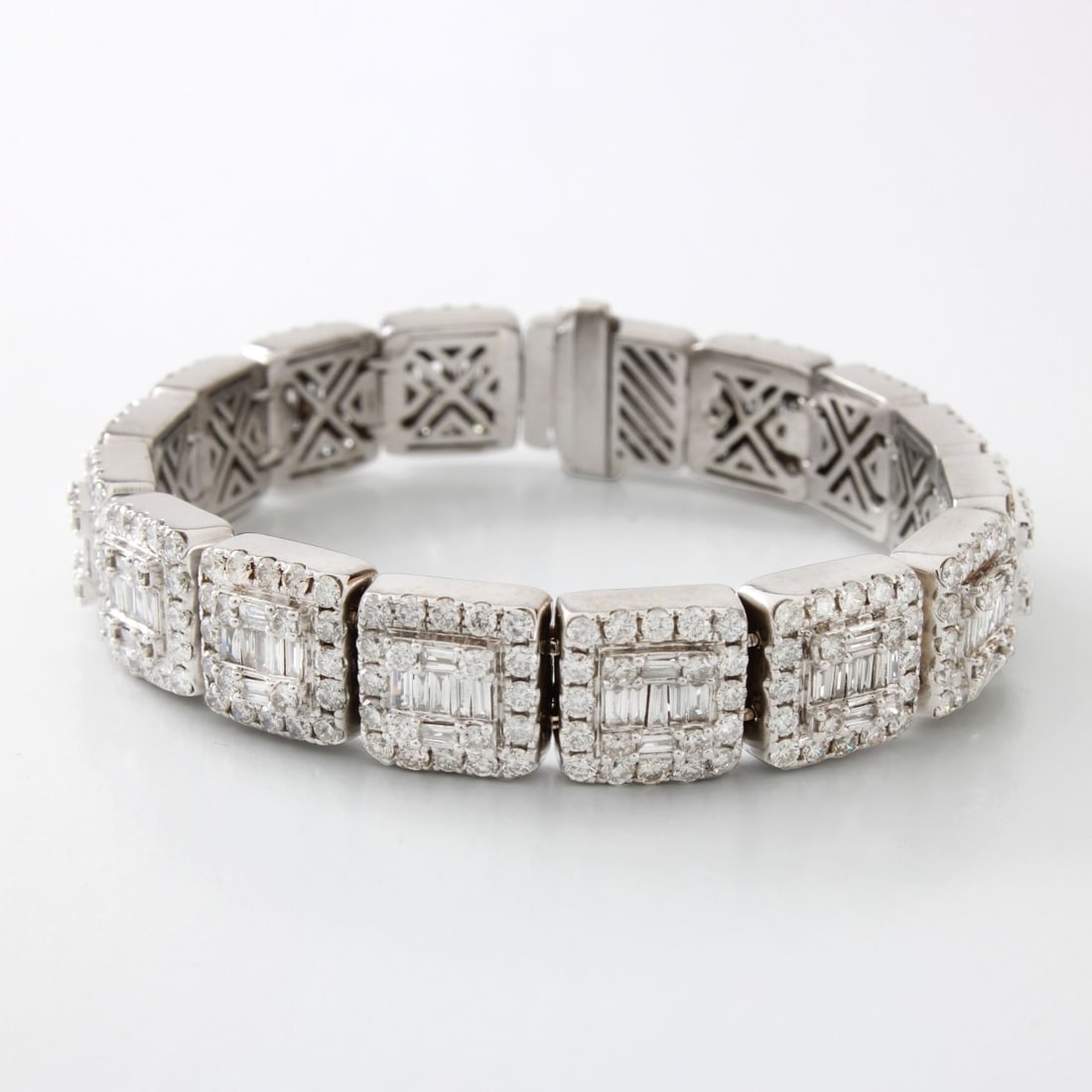 Diamond and 14K Bracelet: Contemporary Design Approx. 6.25 Carat TW Baguette and Round Brilliant Cut Diamond and 14 Karat White Gold Bracelet. Diamonds E-F color, VS1-VS2 clarity. Measures 6-1/8" L, 3/8" W. Approx. weight: