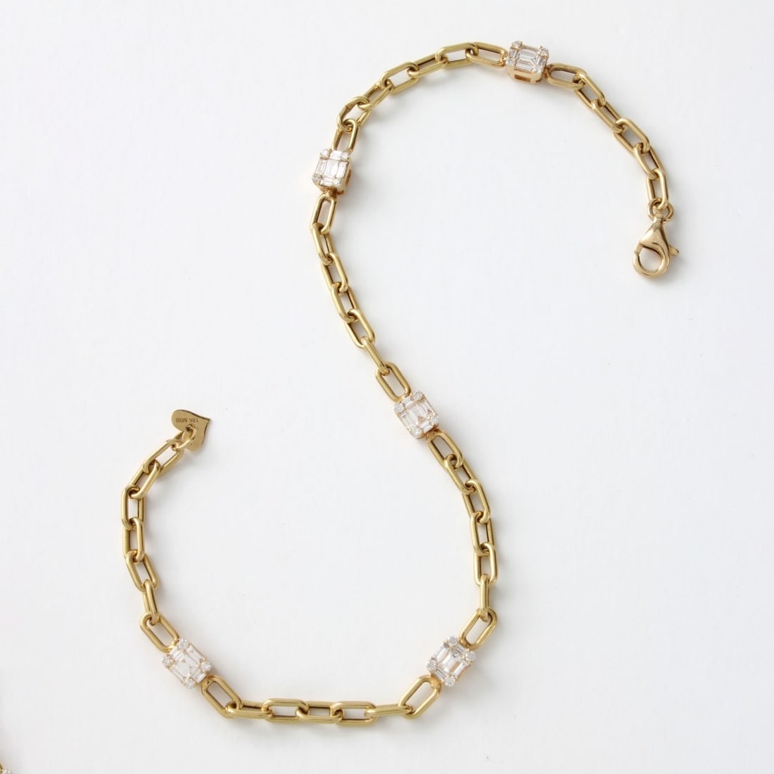 Diamond and 18K Bracelet: Vintage Approx. .45 Carat TW Baguette and Round Brilliant Cut Diamond and 18 Karat Yellow Gold Link Bracelet. Diamonds G-H color, VS-SI clarity. Stamped 18K to clasp. Measures 8-1/4" L. Approx.