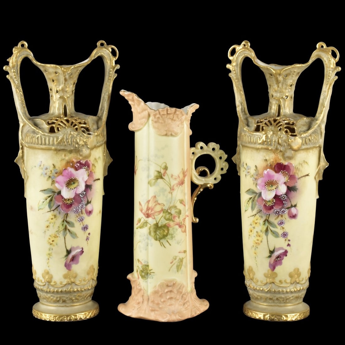 Art Nouveau German Porcelain Vases: Three (3) Art Nouveau German Hand Porcelain Vases with Attached Handles. Two (2) Turn Teplitz and one (1) Rudolstadt each marked to the bottom. Largest two measure: 13-1/4" high, end of handle to end