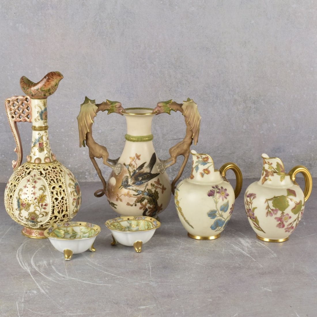 Art Nouveau Porcelain Pieces: Collection of Six (6) Art Nouveau Porcelain Pieces. Consisting of one (1) Alfred Stellmacher Wyvern double dragon porcelain vase circa 1885, properly marked to the bottom, measures: 8" high, 71/2"