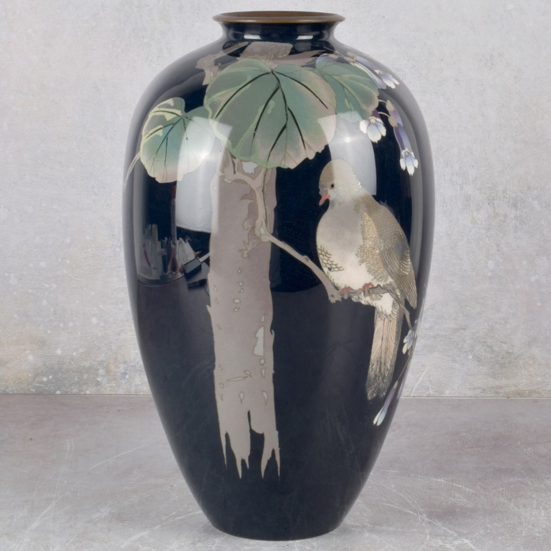 Japanese Cloisonne Vase: Japanese Cloisonne Baluster Shape Vase on Copper. Late 20th century. Decorated with a large dove sitting in branches with morning glories and vines. Measures: 12-1/2" high, 6-3/4" diameter. Kodner