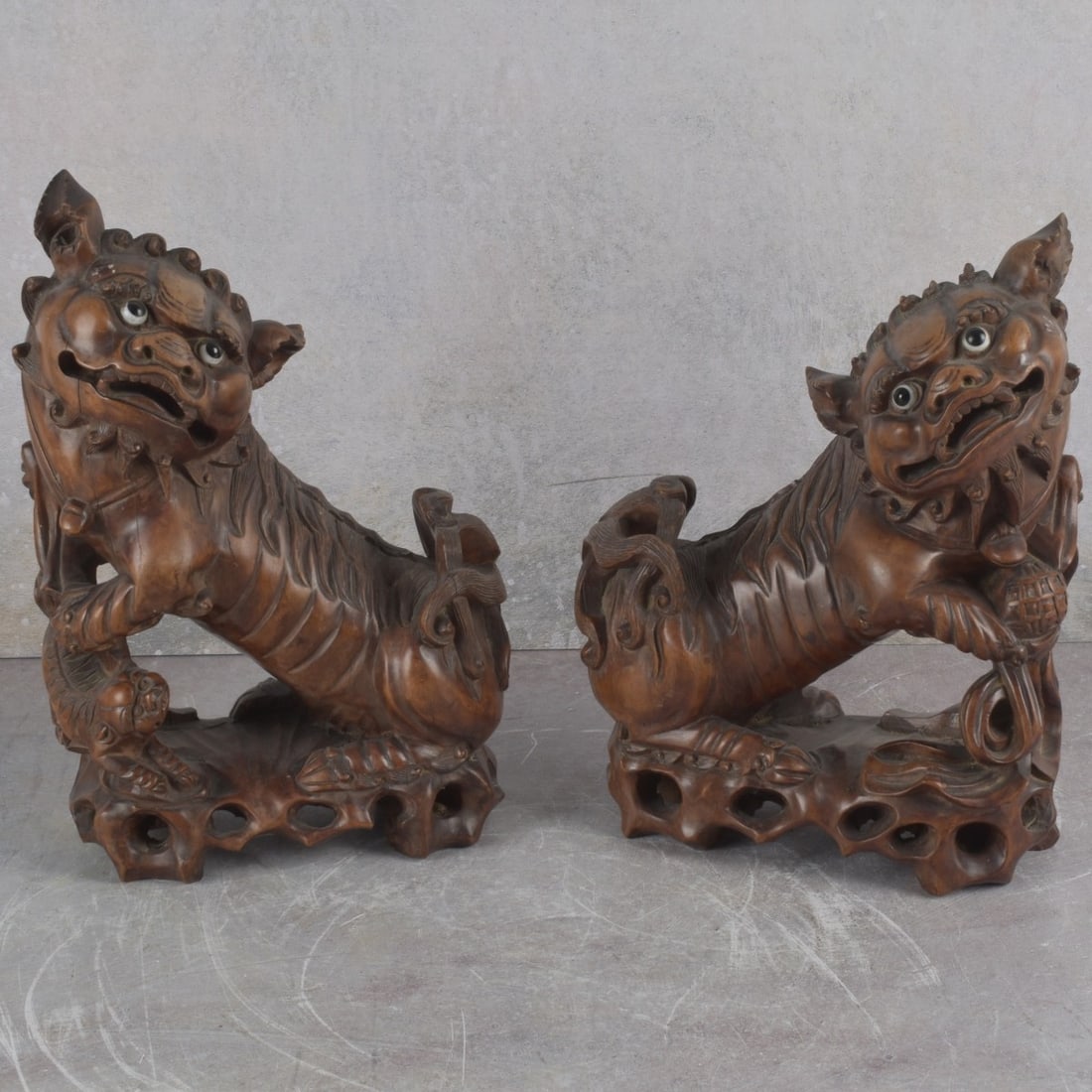 Vintage Chinese Foo Dog Sculptures: Two (2) Vintage Chinese Carved Organic Material Foo Lion Dog Sculptures. Measures: 1-1/2" high, 7-1/2" wide, 3-1/2" deep. Kodner Galleries offers phone and absentee bidding at a low, flat 21% buyer’