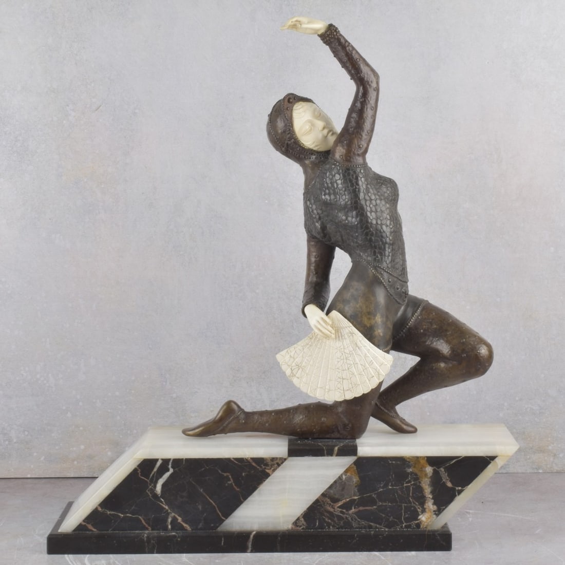 After: Claire Jeanne Colinet, French (1880–1950): After Claire Jeanne Roberte Colinet, French 1880–1950), Sculpture in Bronze and Carved Organic Material on Onyx and Marble Base. Signature to base. Sculpture measures 17" H, 13" L; base measures 4"