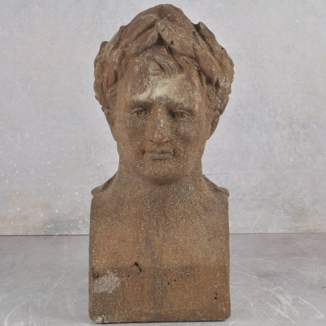 Terra Cotta Pottery Bust: Antique Terra Cotta Pottery Bust, Young Man with Laurel Wreath Crown, Napoleon (?). Unsigned. Measures 12-3/4" H, 5-5/8" W, 5-3/8" D. Kodner Galleries offers phone and absentee bidding at a low, flat
