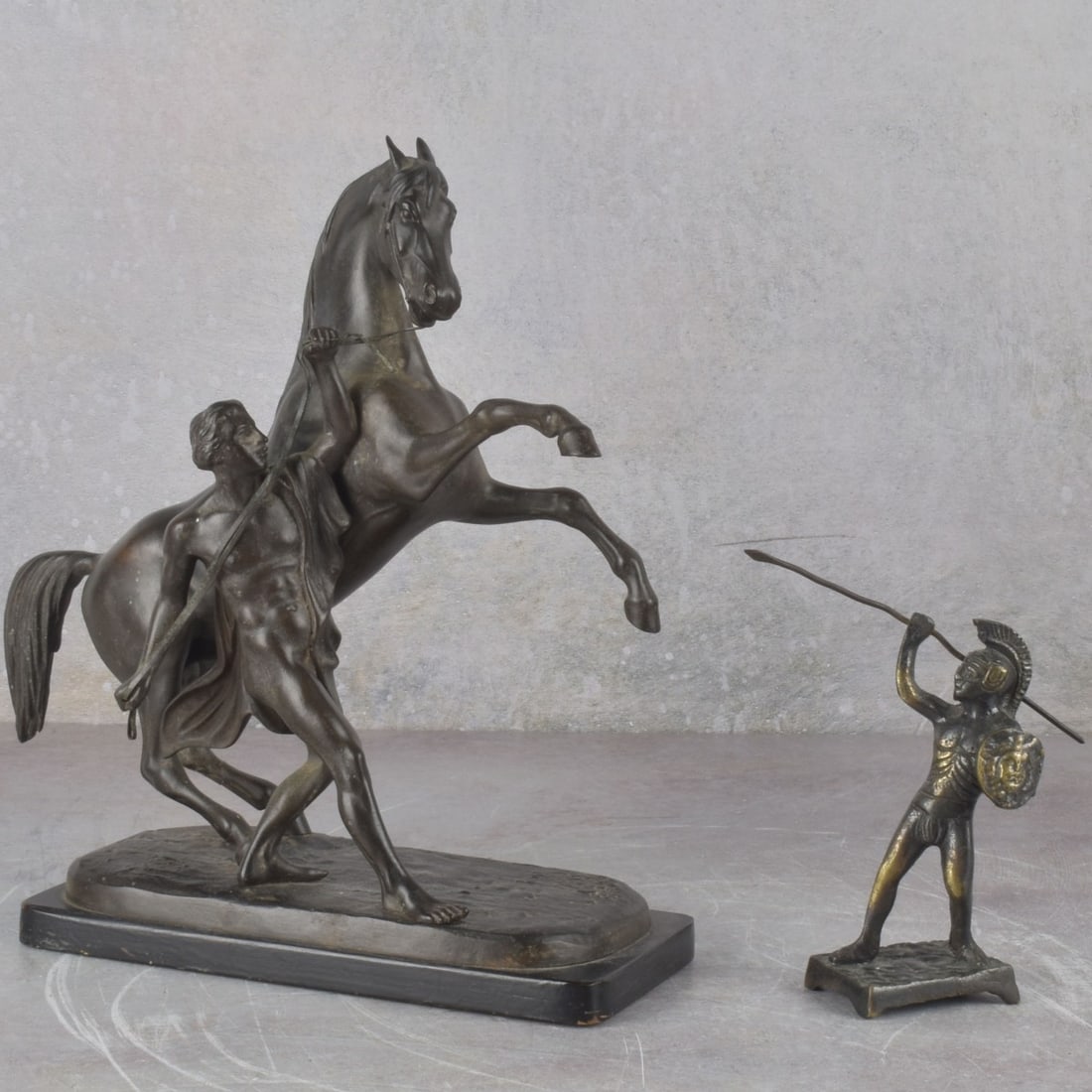 Vintage Bronze Sculptures: Two (2) Vintage Bronze Sculptures. Consisting of one (1) Marley Horse, measures: 10-1/2" high, 9-1/2" wide, 3-1/2" deep, one Roman soldier with shield and spear, measures: 5" high, 1-1/2" wide,