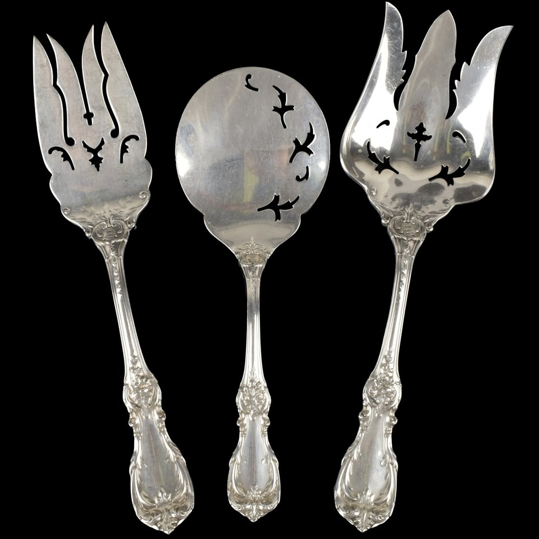 Reed & Barton Sterling Serving Pieces: Three Large Vintage Reed & Barton Sterling Silver Serving Pieces in the "Burgundy" Pattern. To include a pierced casserole spoon and two large forks. Largest fork measures 9-1/4" L, 2-7/8" W. Approx.