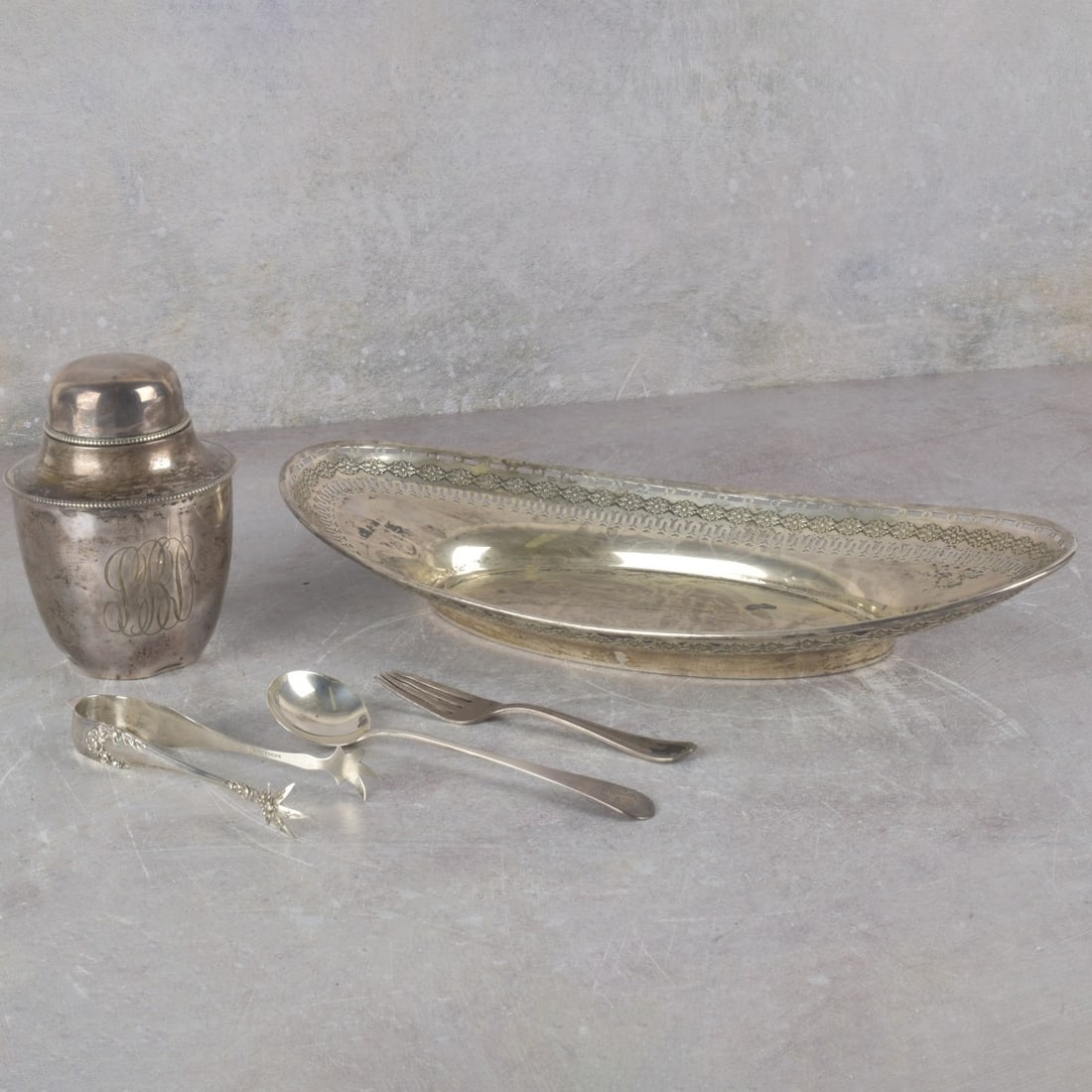 Collection of Sterling Silver Pieces: Five (5) Sterling Silver Pieces. Consisting of one (1) Gorham oval reticulated bread tray, stamped "GORHAM STERLING 446G" with the company monogram, measures: 1-7/8" high, 11-3/4" long, 6-1/8" wide,