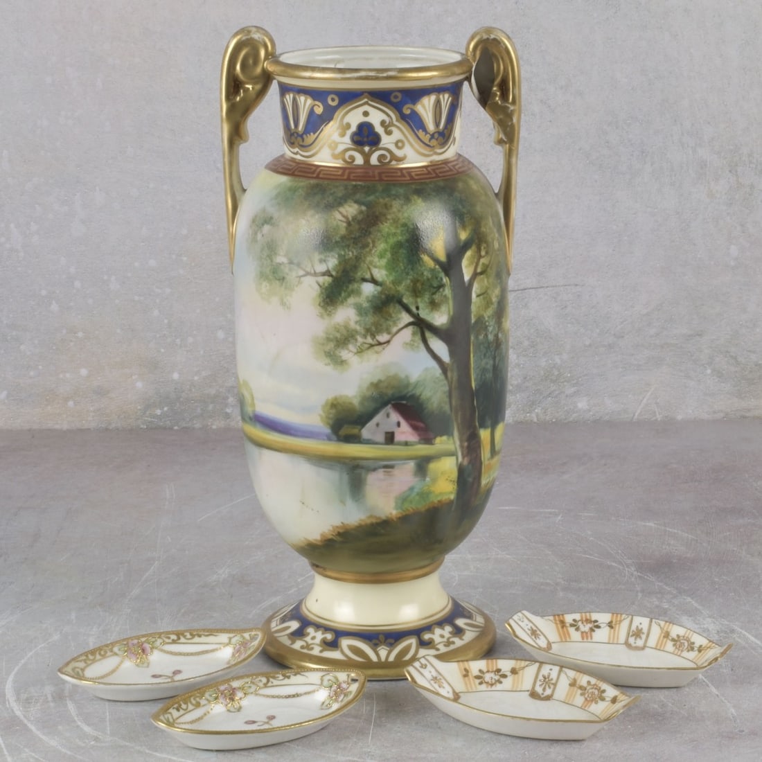 Vintage Nippon Porcelain Pieces: Five (5) Vintage Nippon Porcelain Pieces. Consisting of one (1) double handle landscape urn, measures: 10-3/4" high 4-1/2" diameter, two (2) small trays, measures: 3-3/4" long, 1-3/8" deep, two (2)