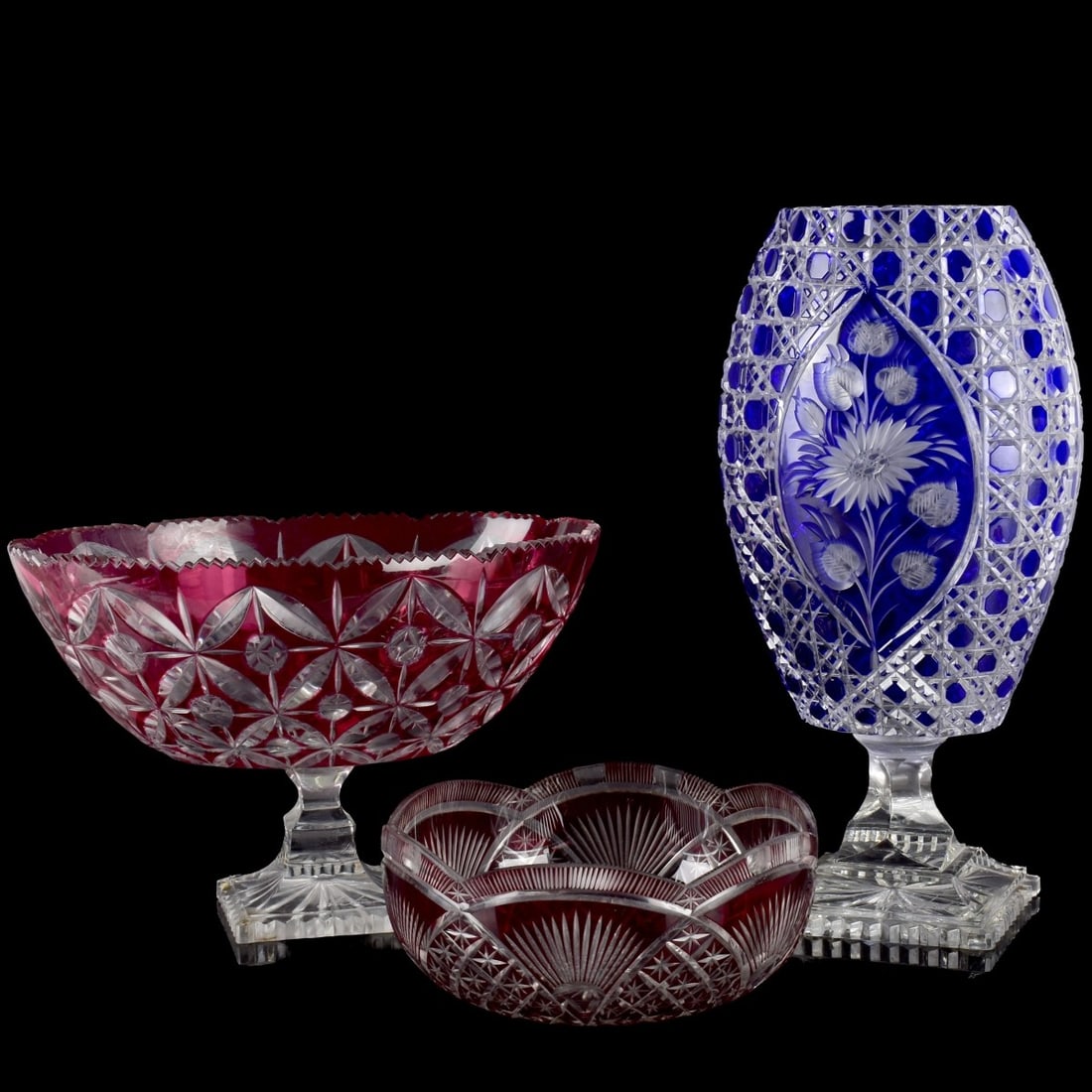 Vintage Collection of Cut Crystal: Vintage Collection of Three (3) Cut Crystal Pieces. Consisting of one (1) footed cobalt blue cut to clear vase signed, measures: 14-1/4" high, 6-1/2" wide, 4" deep, one (1) footed cranberry cut to