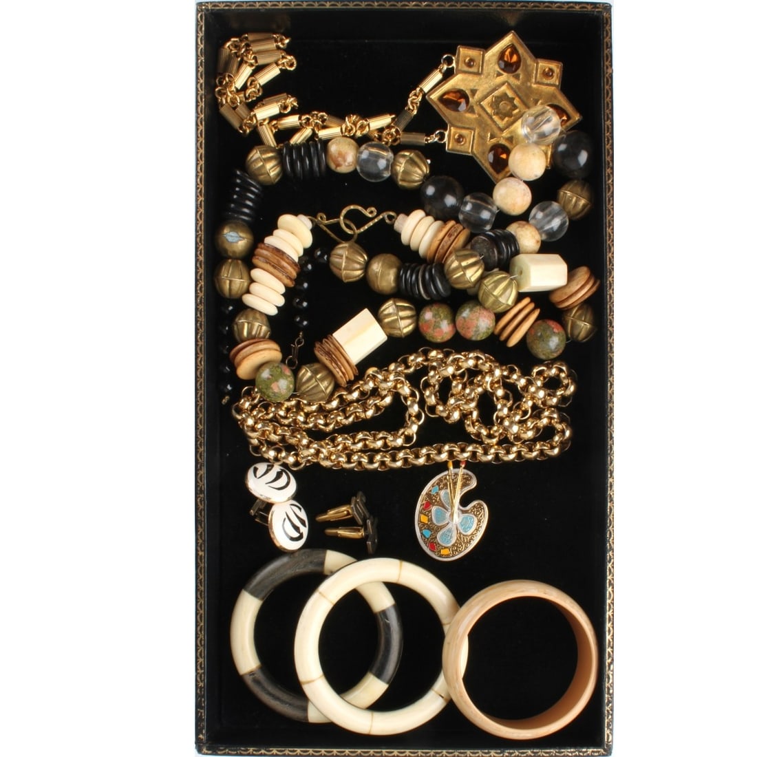 Fashion Jewelry: Tray Lot of Fashion Jewelry. To include three (3) cuff bangle bracelets, four (4) necklaces, two (2) pair of cufflinks and one (1) pin. Variously accented with bone, horn, enamel, metal, stone, glass