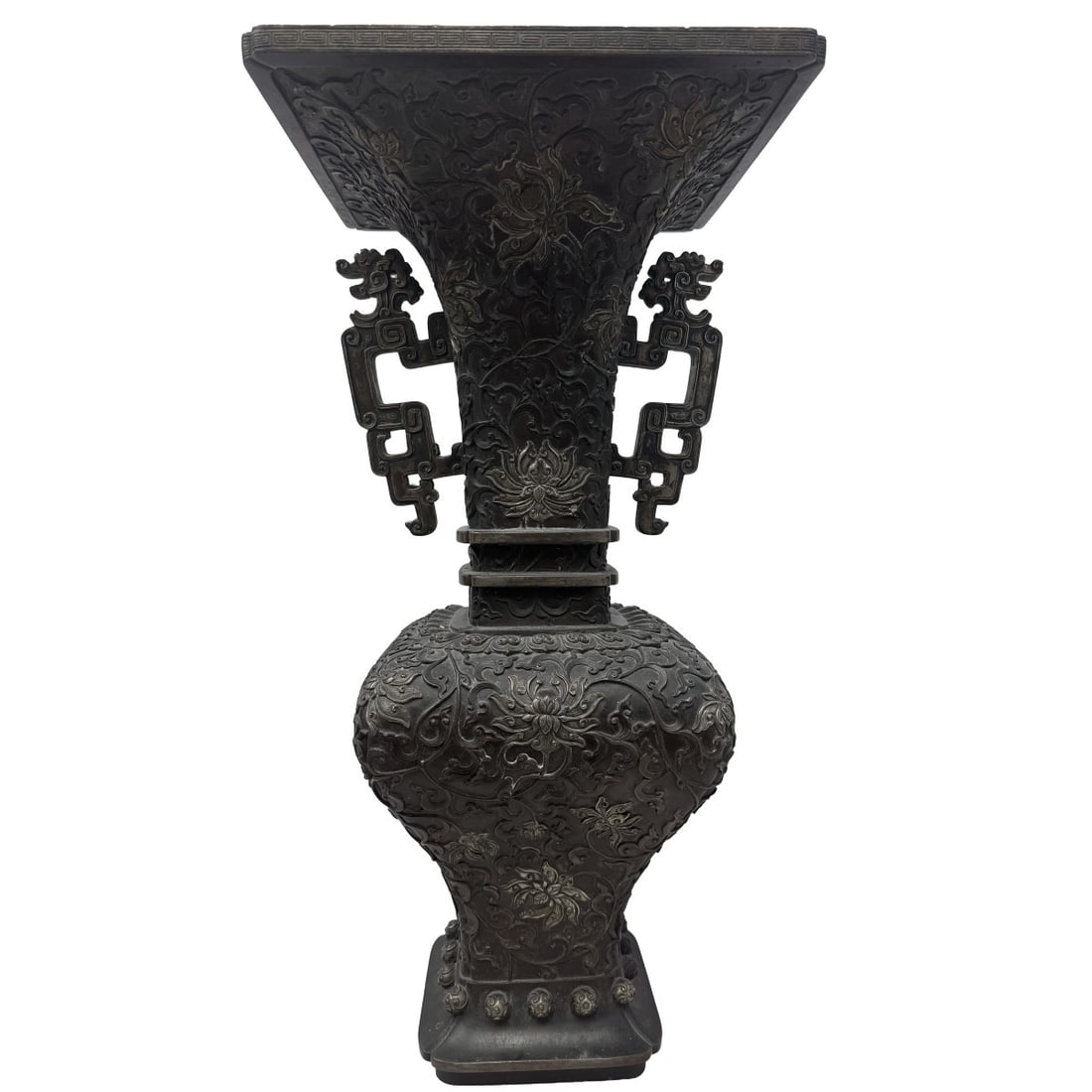Large Chinese Bronze Temple Vase: Large Chinese Bronze Temple Vase. 19th/20th century. Made by using the loss wax technique. Bulbous at the bottom extreame flair to the top. Decorated with lotus and vine design having dragon handles.
