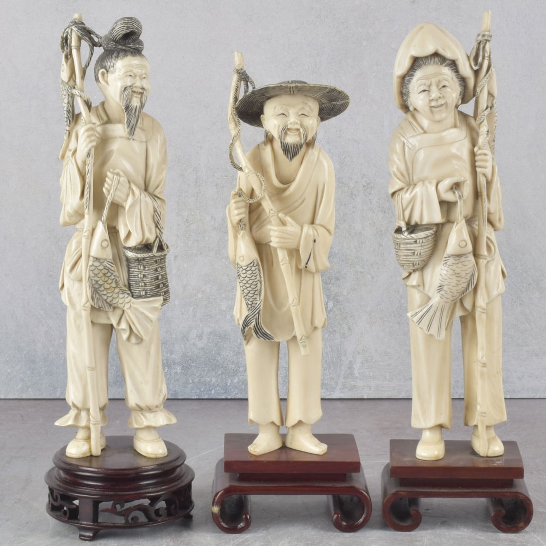 Antique Carved Fisher Sculptures: Three (3) Antique Carved Organic Material Fisher Sculptures on Wood Basses. We Will Not Ship This Item Outside of the State of Florida. Anyone Having This Item Shipped Must Have a Florida Address or t