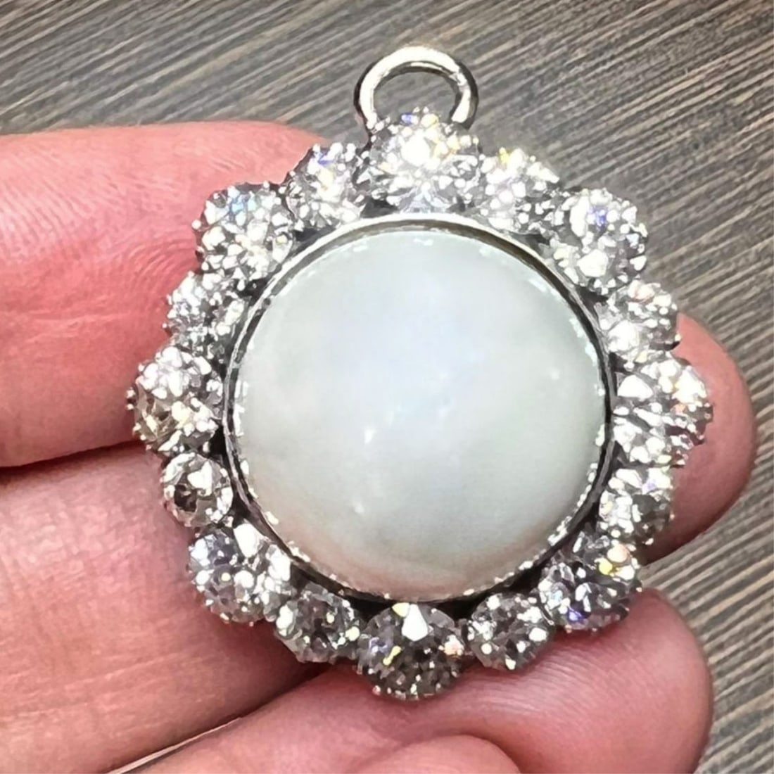 Pearl, Diamond and 18K Pendant: Vintage 18mm South Sea Pearl, Approx. 8.0 Carat TW Sixteen Round Brilliant Cut Diamond and Silver Topped 18 Karat White Gold Pendant. Pearl with very good luster and polish. Diamonds F-H color, VVS-VS