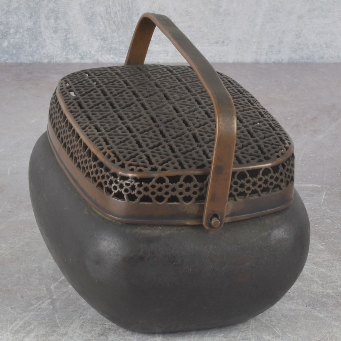 Antique Chinese Bronze Cricket Box: Antique Chinese Bronze Cricket Box with Attached Handle. With handle down measures: 3-1/4" high, 5-1/4" wide 3-5/8" deep. Kodner Galleries offers phone and absentee bidding at a low, flat 21%