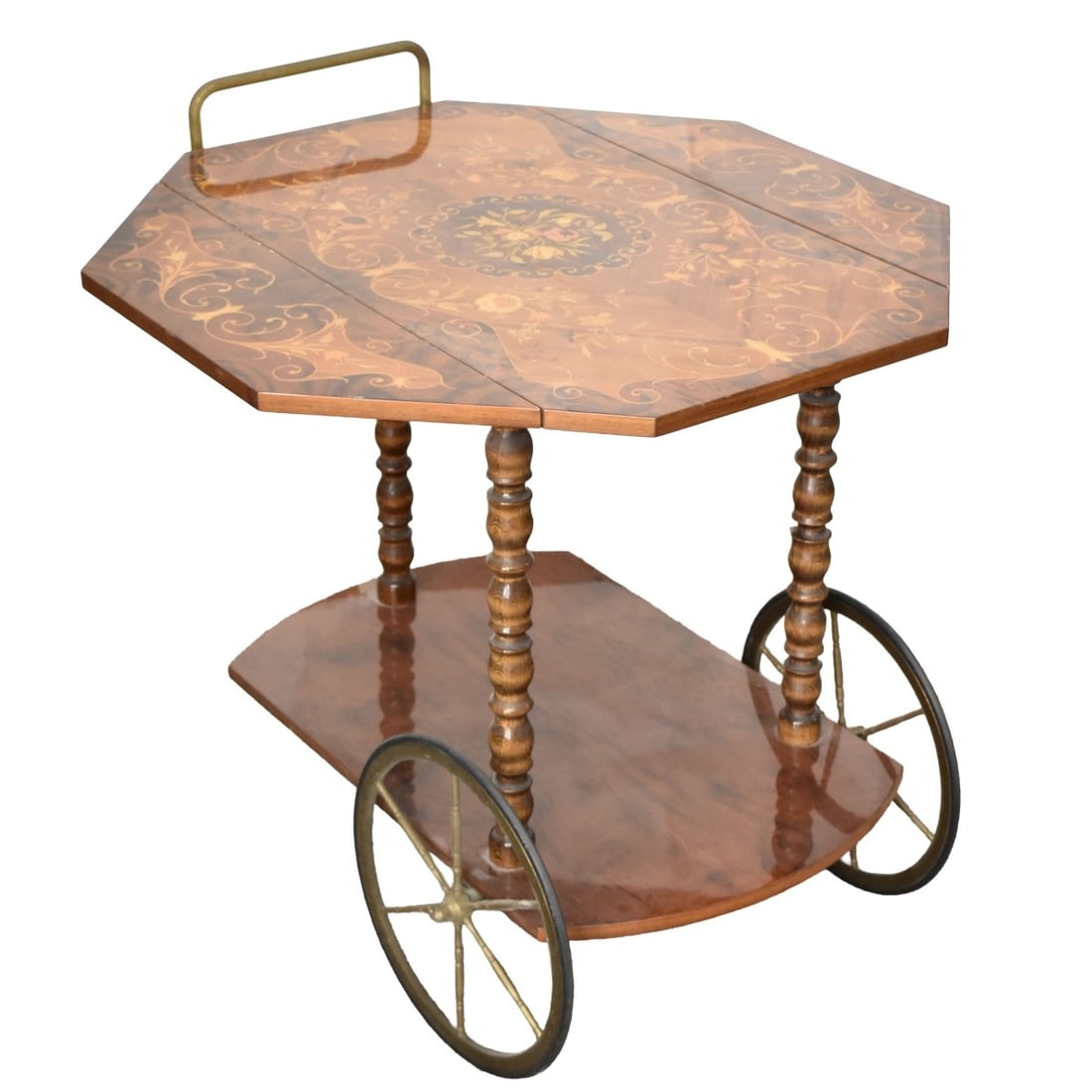 Italian Marquetry Tea Cart: Mid 20th Century Italian Floral Marquetry Inlaid Mixed Wood Two Tier Rolling Tea Cart with Brass Wheels and Handle. Tag to underside, Made in Italy. Measures (closed): 27-1/2" H, 30-1/2" L, 19-1/2" W
