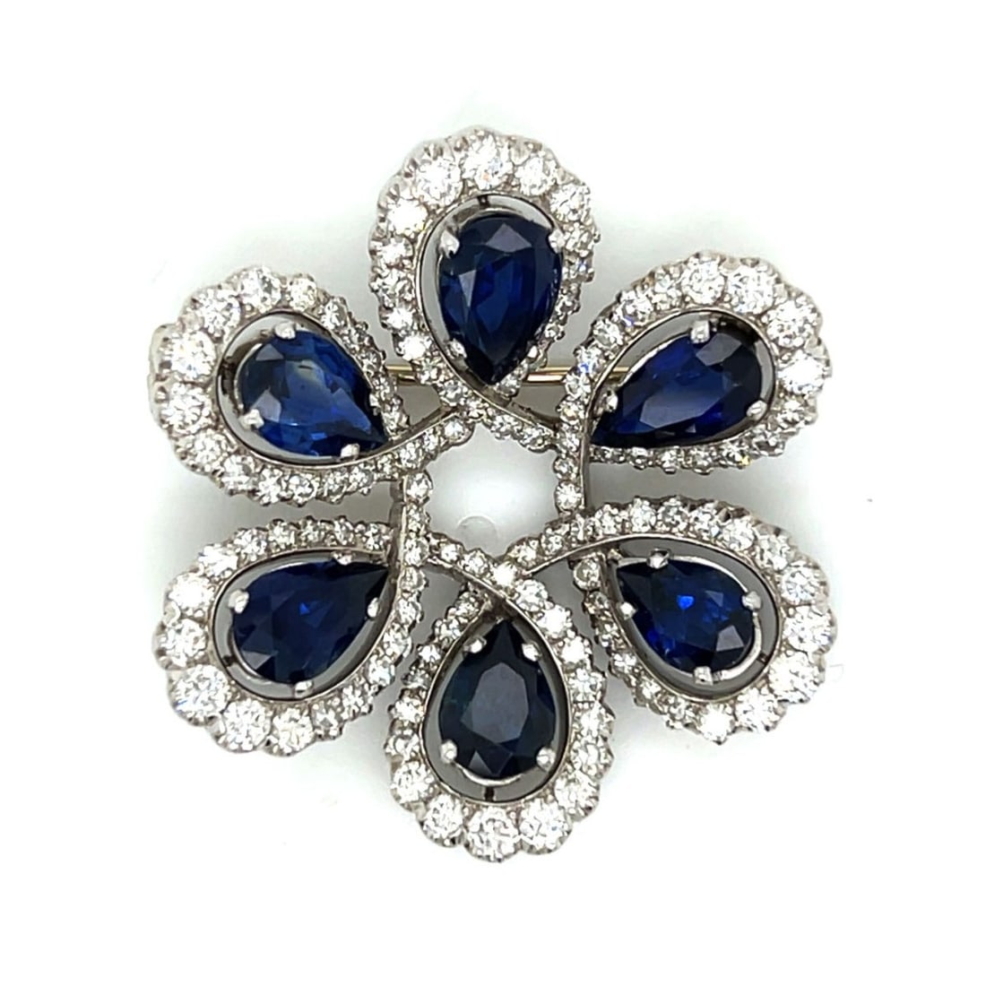 Deco Sapphire, Diamond and Plat. Brooch: Art Deco Approx. 9.0 Carat TW Six Pear Shape Sapphires, 3.50 carat TW One Hundred Twenty Round Brilliant Cut Diamonds and Platinum Brooch. Sapphires with vivid color. Diamonds F-G color, VVS-VS clarit