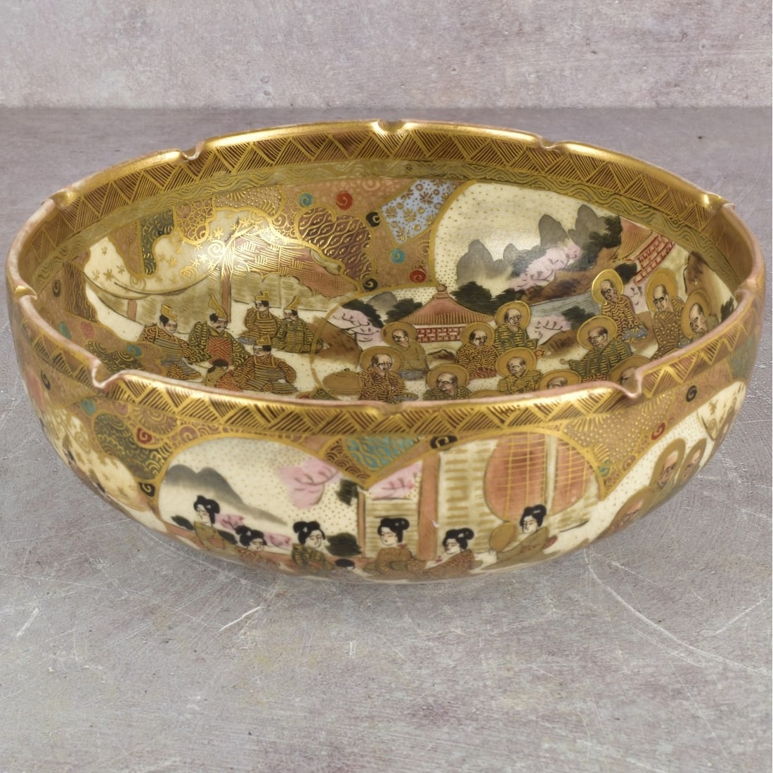 Japanese Meiji Satsuma Bowl: Antique Japanese Meiji Period (1868-1912) Satsuma Ware Bowl in Heavy Gilded Polychromatic Enamels of Noblemen and Geishas with a Pinched Top Rim. Signature chop mark to the bottom. Measures: 2-7/8" hi