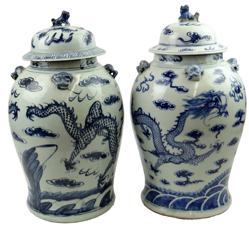 Pair of 19/20th Century Chinese Blue and White Porcelai: Pair of 19/20th Century Chinese Blue and White Porcelain Baluster Jars with Covers each Jar with Dragon Chasing the Flaming Pearl Decoration and with Buddhist Lion Mask Handles. Unsigned. One Cover "A