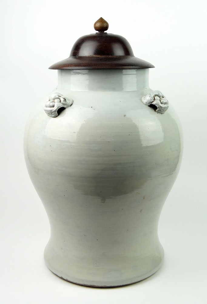Large 18th Century Chinese White Glaze Porcelain Balust: Large 18th Century Chinese White Glaze Porcelain Baluster Vase with Applied Buddhist Lion Mask Handles and With Modern Wood Lid. Unsigned. Good Condition or Better. Measures 19 Inches Tall and 14 Inch