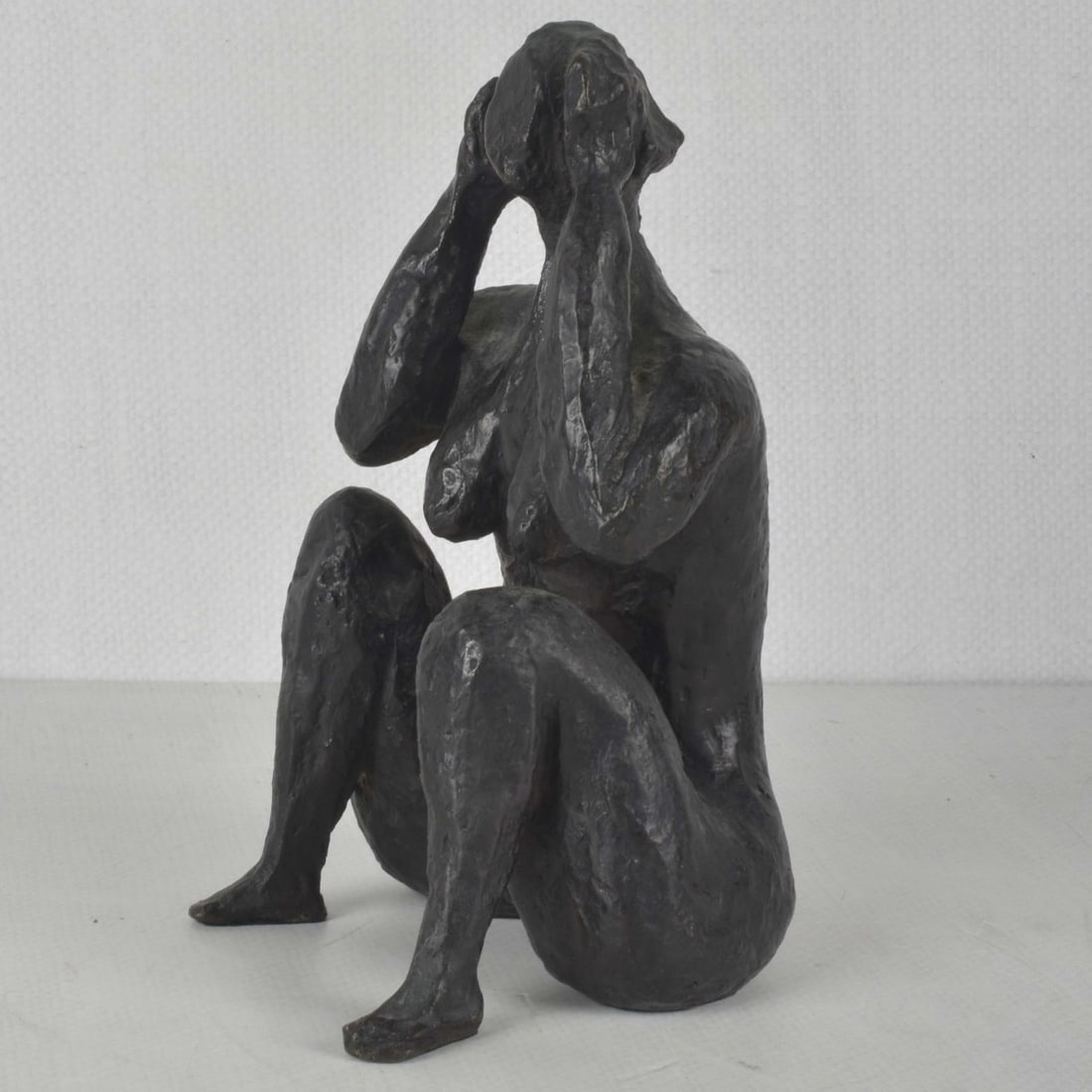 Patinated Bronze Nude Sculpture: Patinated Bronze Nude Sculpture Both Hands to Her Head. Signed and numbered "3/6" as well as foundry mark in the bronze. Measures: 8" high, 4-1/4" wide, 4-1/2" deep. Kodner Galleries offers phone and 