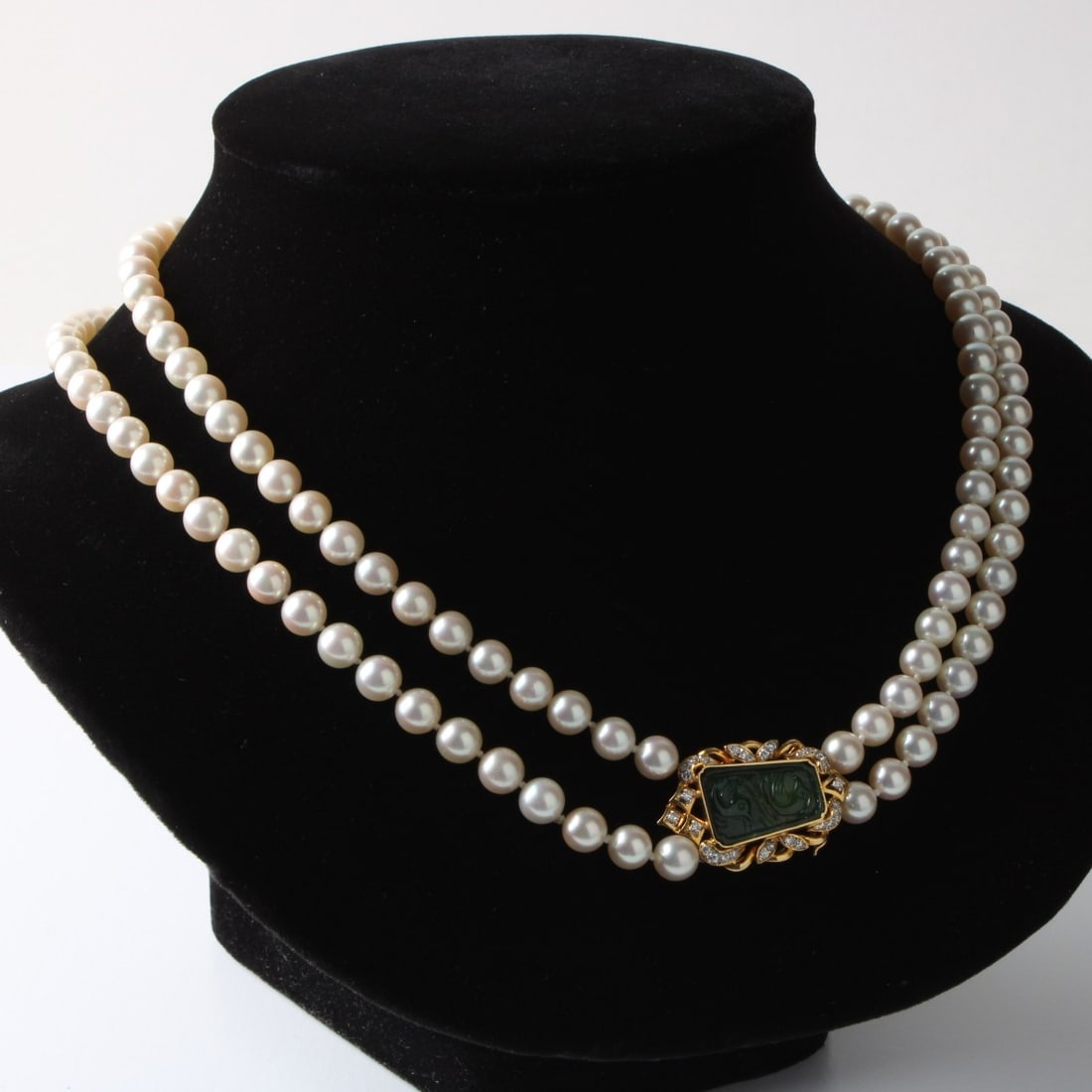 Pearl, Jade and Diamond Necklace: Very Fine Double Strand 7mm Pearl Necklace with Antique Chinese Carved Jade, Round Brilliant Cut Diamond and 18 Karat Yellow Gold Clasp. Diamonds G-H color, VS clarity. Clasp stamped 18K 750. Necklace