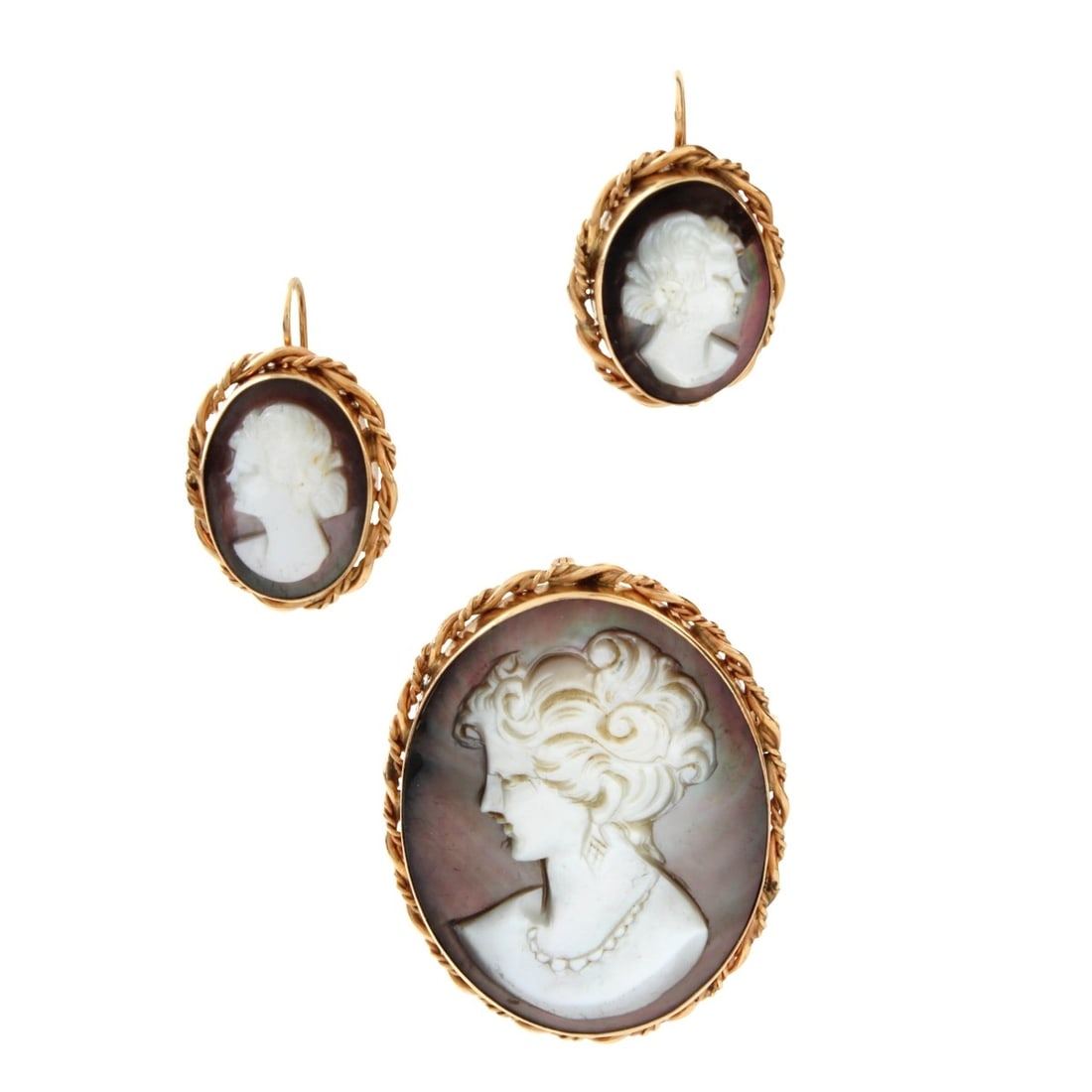 Shell and 14K Cameo Set: Vintage Carved Shell and 14 Karat Yellow Gold Cameo Pendant / Brooch and Earrings Set. Stamped 14K, Pendant / Brooch measures 1-5/8" L. 1-1/4" W; earrings measure 1" L, 5/8" W. Approx. total weight:
