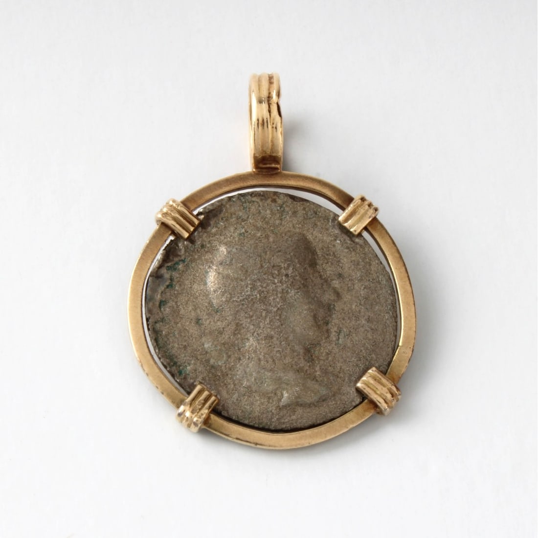 Roman Coin and 14K Pendant: Ancient Roman Imperial Coin and 14 Karat Yellow Gold Pendant. Measures 1-1/4" L, 7/8" diam. Approx. gross weight: 4.56 grams. Kodner Galleries offers phone and absentee bidding at a low, flat 21%